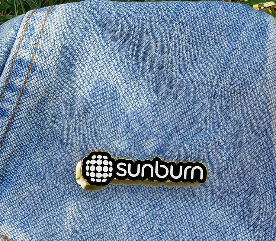 Sunburn lapel pin